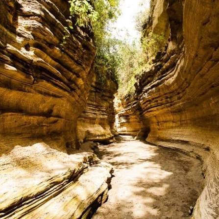 Hikers walking through Ol Njorowa Gorge at Hell's Gate